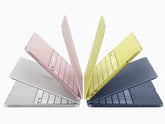Profile view of open 13-inch MacBook Neo A18 Pro, highlighting its wedge-shaped chassis design and sharp display edge.