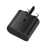Straight-on front view of a Samsung 25W wall charger, highlighting the clean matte texture, debossed Samsung branding, and the vertical alignment of the electrical prongs.