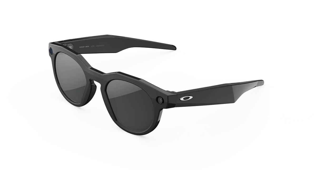 Black sunglasses with a white background Side profile of Oakley HSTN smart glasses, highlighting the open-ear audio stem, touch controls, and front camera bezel.